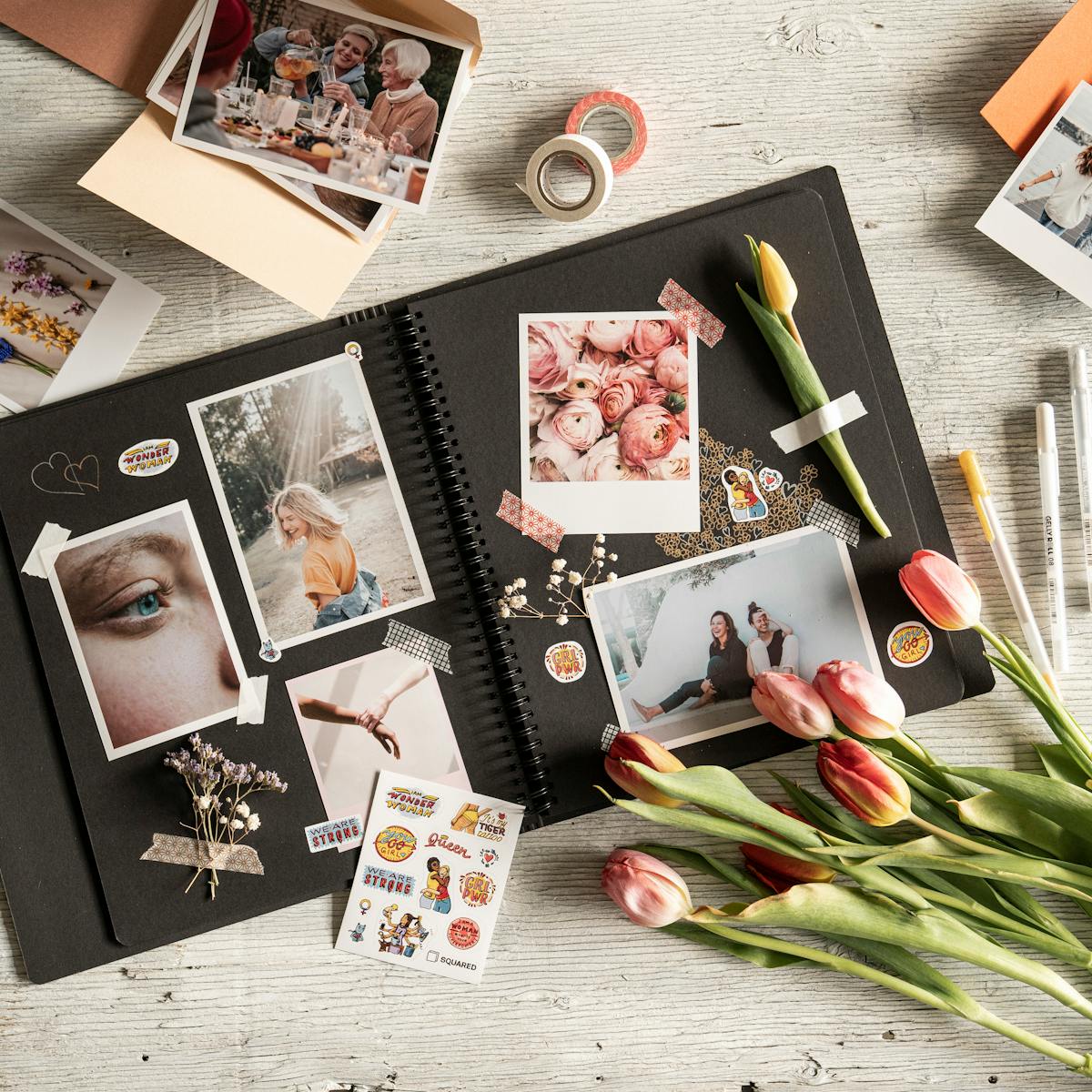Artistic scrapbook with photos, tulips, and decorative elements, perfect for DIY inspiration.
